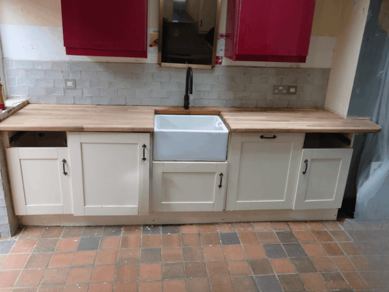 Iroko kitchen worktop shaped and fitted for smooth flow around doors