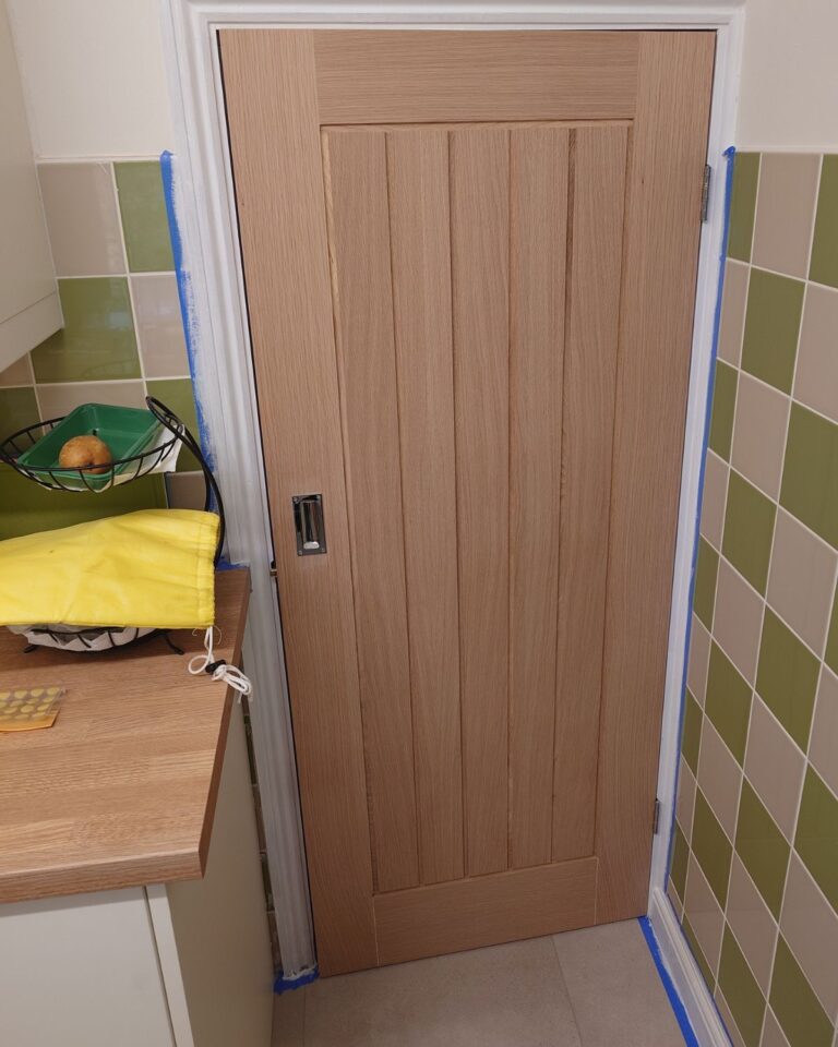 Oak veneered door with grooves installed in Rugby