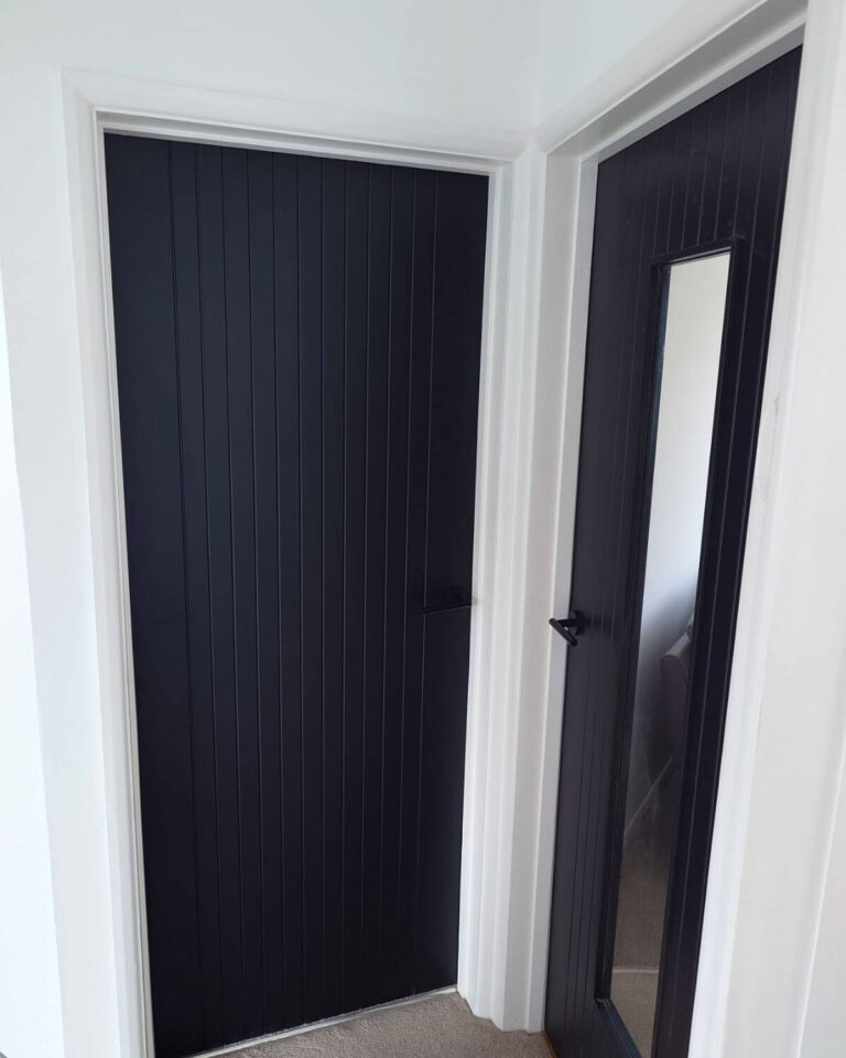 Bespoke joinery fitted doors with panel detailing
