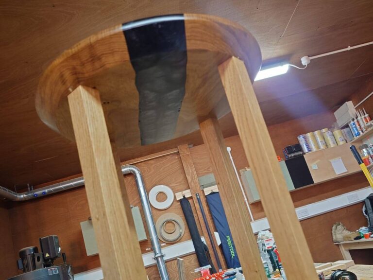 Handmade live-edge oak side table with black resin river